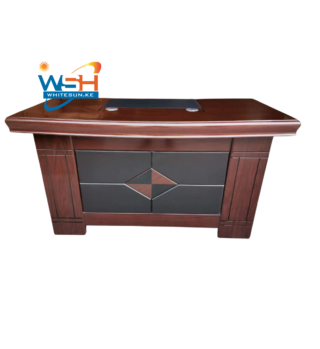 An elegant wooden office desk with cable management grommets
