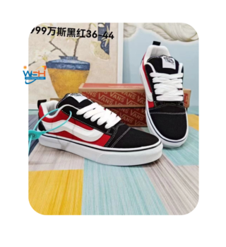 Black Vans Sneakers with White Stripe