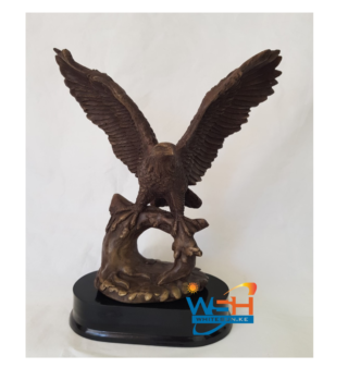 FLYING EAGLE ON TREE TRUNK