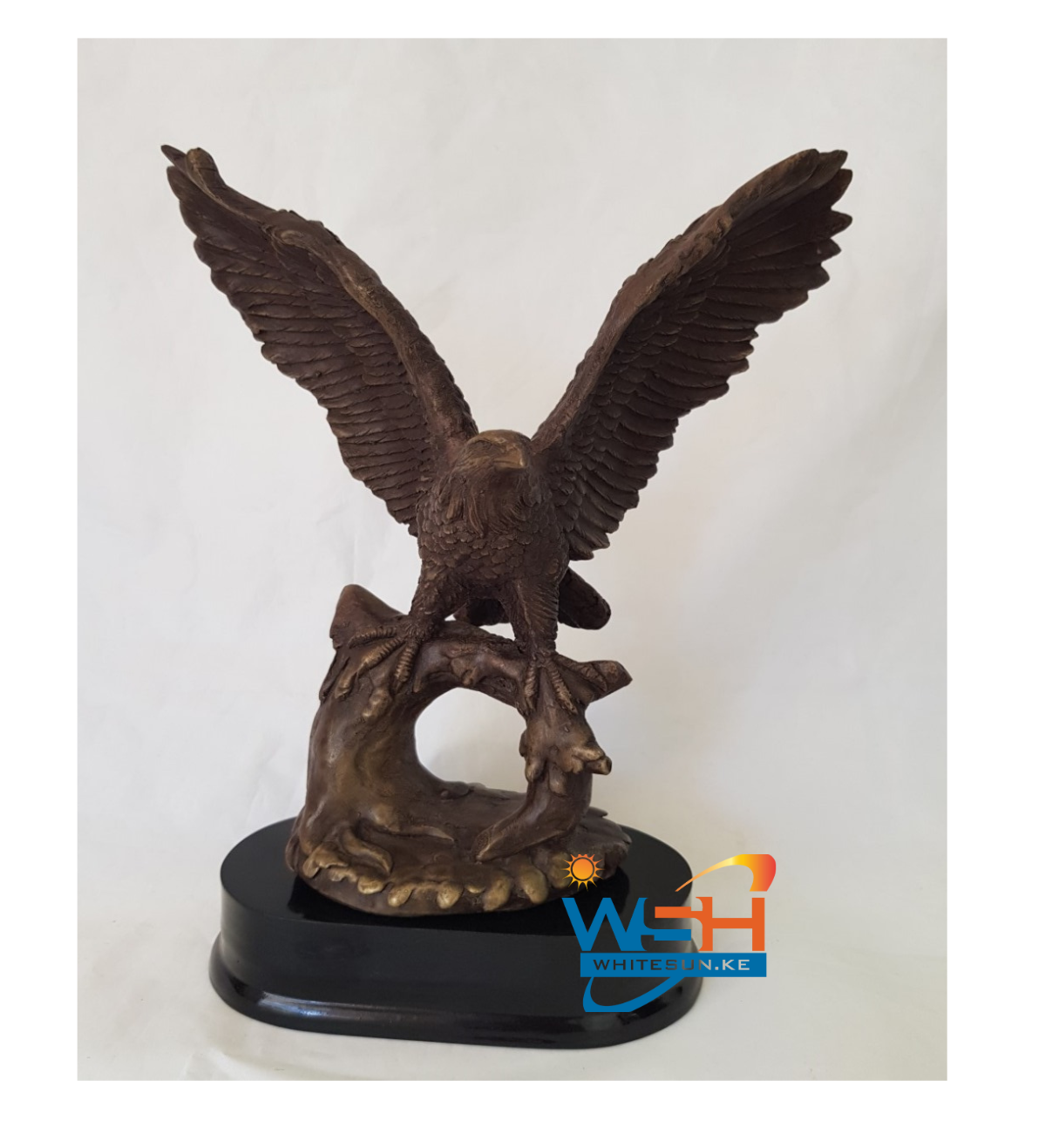FLYING EAGLE ON TREE TRUNK