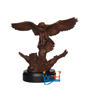 EAGLE ON A TREE TRUNK